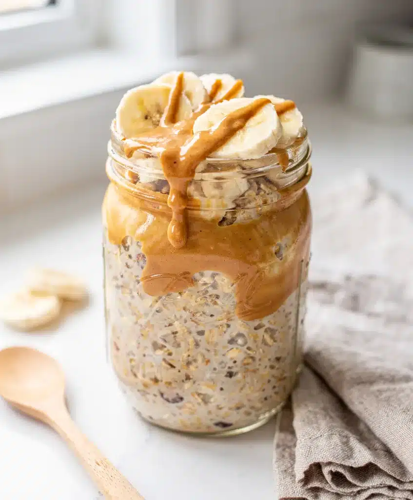 Creamy peanut butter banana overnight oats in a jar with chia seeds