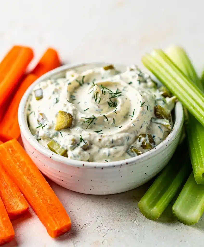 Creamy dill pickle ranch dip with fresh herbs and crunchy vegetable dippers