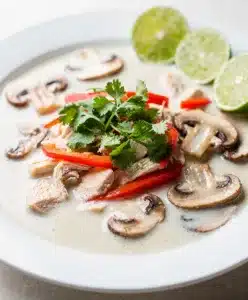 Creamy Thai coconut chicken soup with tender chicken and fresh cilantro garnish