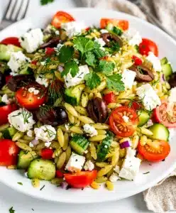 Greek Orzo Salad with feta olives tomatoes cucumber and fresh herbs