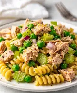 Lemon pepper tuna pasta salad with peas red onion celery and creamy dressing