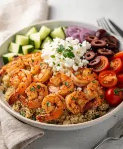 Mediterranean shrimp bowl with feta olives and fresh vibrant vegetables