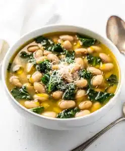 Creamy white bean kale soup recipe with a savory rich broth and rustic bread
