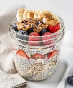 Creamy overnight oats with almond butter yogurt and fresh berries for brunch.
