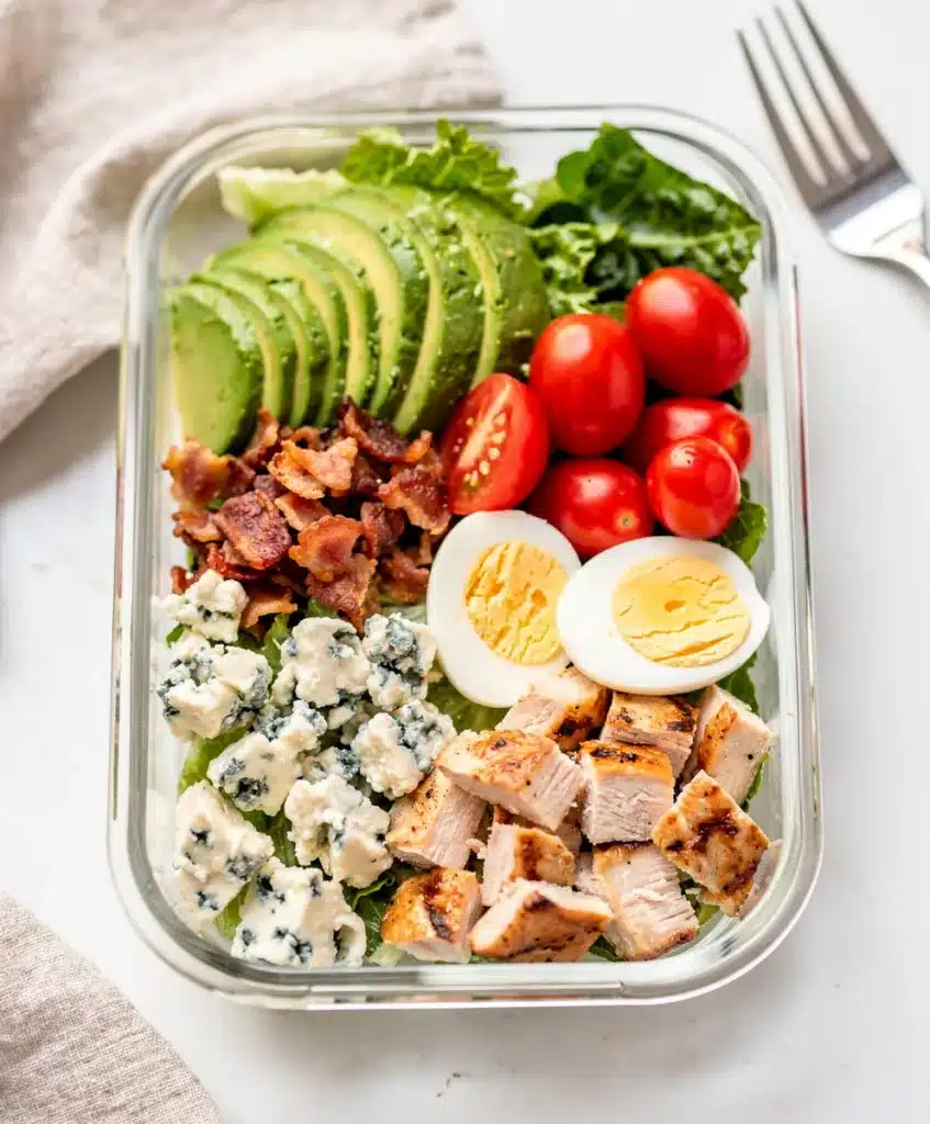 Cobb salad meal prep bowl with avocado bacon and blue cheese