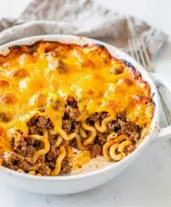 Creamy ground beef casserole with egg noodles and melted cheddar cheese.
