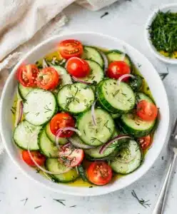 Make ahead cucumber salad recipe with crisp slices and glossy dressing