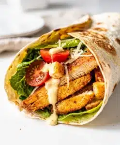 Crunchy Chicken Caesar Wrap recipe with grilled chicken and creamy Caesar dressing.