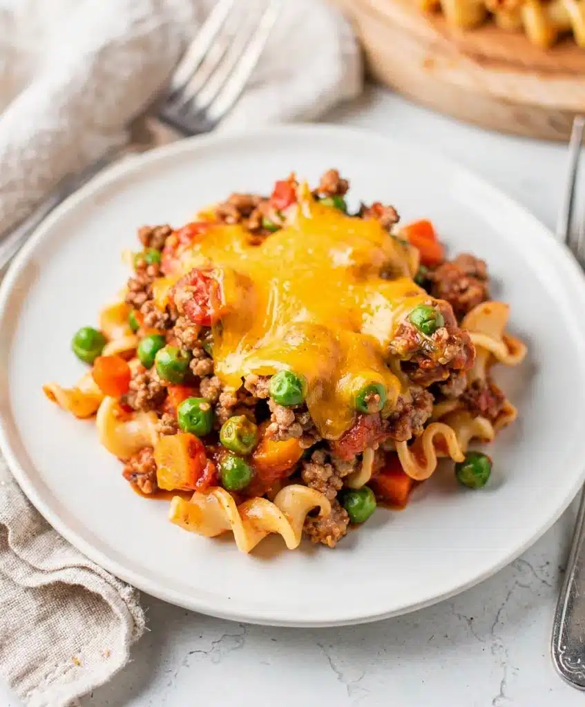 Crowd favorite ground beef casserole with noodles vegetables and melted cheese
