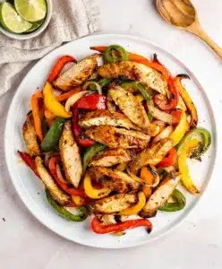 Juicy sheet pan chicken fajitas with charred peppers and warm tortillas