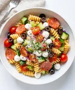 Make ahead Italian pasta salad with fresh vegetables and mozzarella pearls