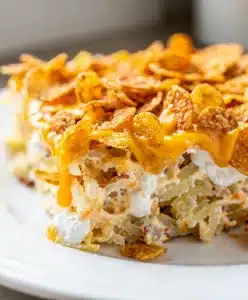 Creamy crockpot hashbrown casserole with crispy golden cornflake topping.