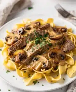 Creamy skillet beef stroganoff with tender beef and mushrooms over egg noodles