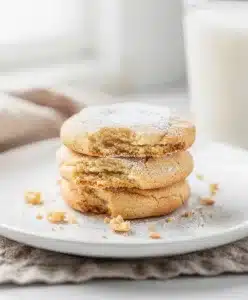 Classic soft sugar cookies with creamy frosting and colorful sprinkles close up