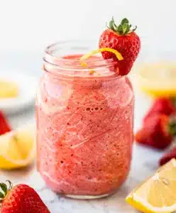 Make ahead strawberry lemonade smoothie in a jar on bright kitchen counter