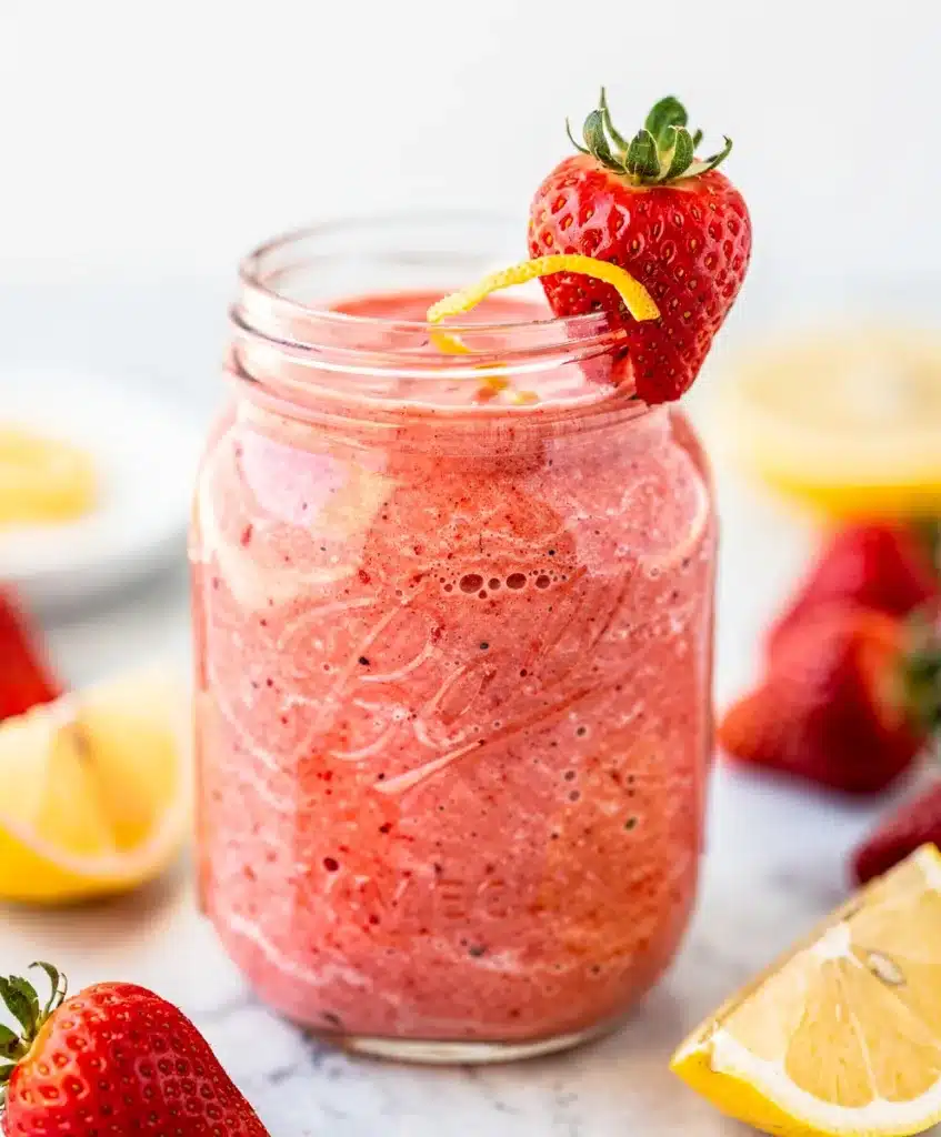 Make ahead strawberry lemonade smoothie in a jar on bright kitchen counter