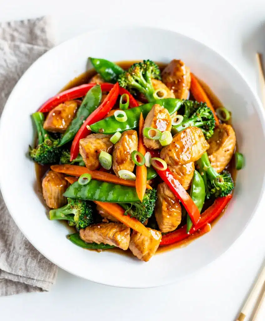 Teriyaki chicken stir fry with broccoli and peppers in glossy sauce