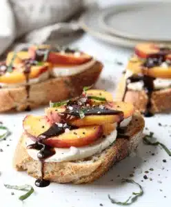 Balsamic peach crostini recipe with mozzarella on toasted rustic baguette