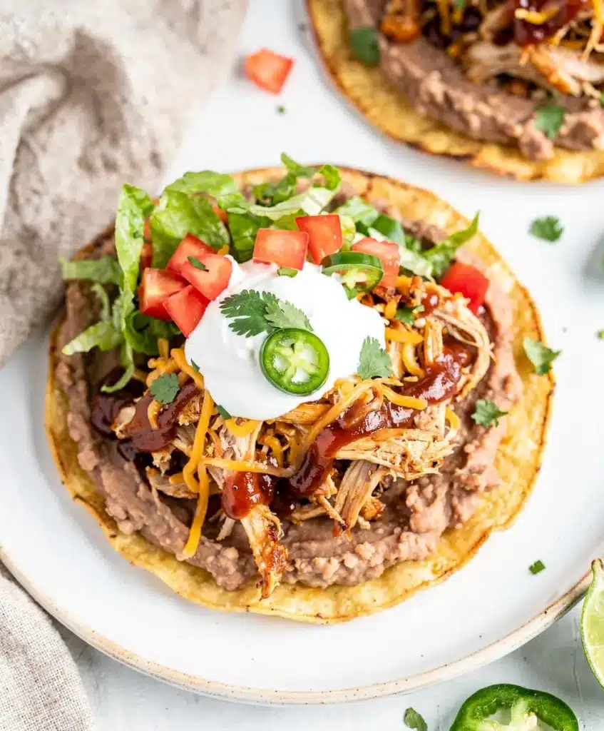 BBQ Chicken Tostadas with melted cheese and creamy beans