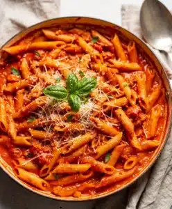 Creamy tomato pasta with sausage in a cozy one pot recipe.