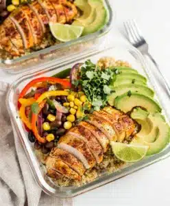 Make ahead chicken meal prep bowls with quinoa, beans, corn, and avocado.