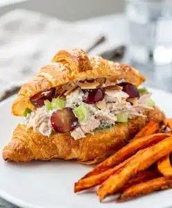 Creamy Sonoma chicken salad with red grapes and toasted almonds close up.