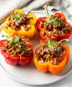 Teriyaki glazed stuffed bell peppers with creamy rice filling.
