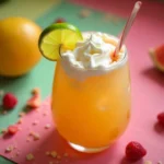 Dirty soda served in a mason jar with lime wedges, cherries, and a paper umbrella on a rustic table.