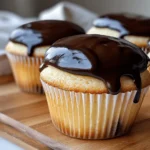 Delicious homemade Boston Cream Cupcakes with custard and chocolate glaze.