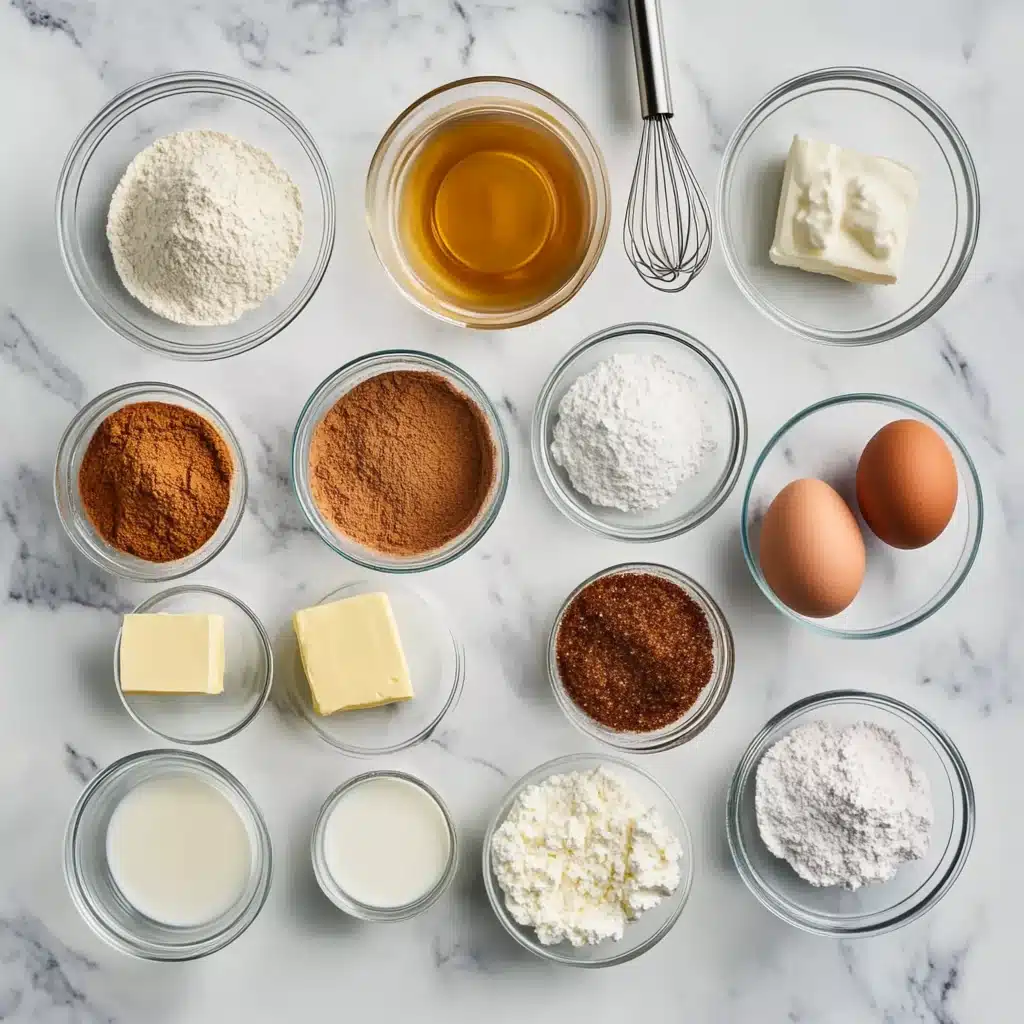 Flat lay of cinnamon roll pancake ingredients on marble surface