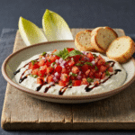 Creamy bruschetta dip with tomatoes basil and balsamic glaze