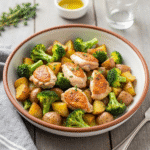 Easy sheet pan dinner with roasted chicken, potatoes, and broccoli.