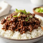 Quick and easy Korean ground beef bowl with rice and green onions.