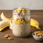 Healthy banana bread overnight oats in a jar with walnuts and banana