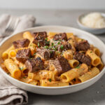 Cajun steak tips with cheesy rigatoni in a creamy parmesan sauce.