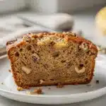 Moist classic banana bread recipe with walnuts in a close up food photo