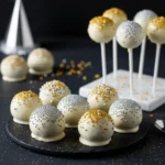 New Years Eve cake ball drops with gold and silver sprinkles.