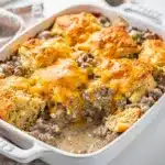 Golden brown biscuits and gravy breakfast casserole with sausage and cheese