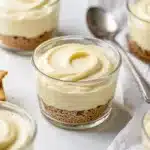 Creamy no bake cheesecake cups with a crumbly graham cracker crust.
