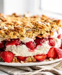 Strawberry cheesecake dump cake recipe with golden oat crumble topping.