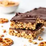 Easy Super Bowl desserts like peanut butter bars and apple hand pies on a wooden platter.
