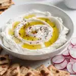 Creamy whipped feta dip drizzled with hot honey and red pepper flakes.