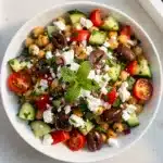 Colorful Mediterranean chickpea salad with feta olives and fresh vegetables recipe.
