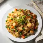 Classic chicken fried rice recipe with glossy sauce and crispy rice bits