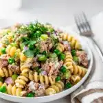 Creamy tuna pasta salad with rotini peas and a glossy dressing