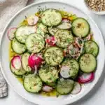 Crisp cucumber radish salad with fresh dill and toasted sunflower seeds