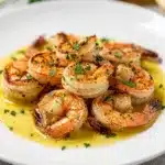 Garlic lemon shrimp skillet with buttery sauce and crusty bread for dipping