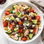 Greek chicken pasta salad with rotini, feta, olives, and lemony herb vinaigrette.