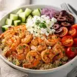 Mediterranean shrimp bowl with feta olives and fresh vibrant vegetables