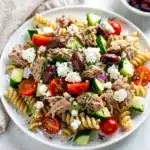 Mediterranean tuna pasta salad with fresh vegetables and lemon herb vinaigrette.